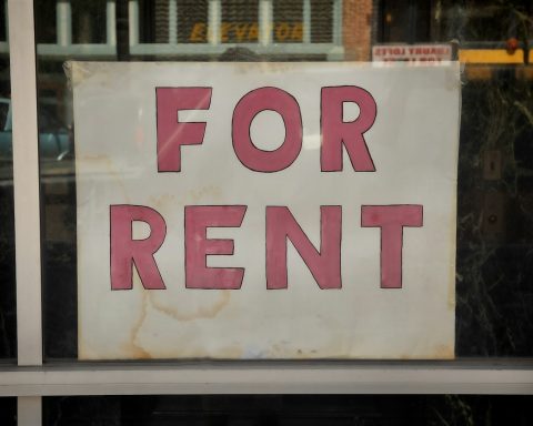 a for rent sign in a store window