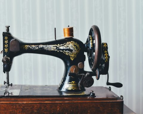 black and yellow metal sewing machine