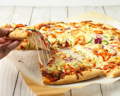 pizza on brown wooden table