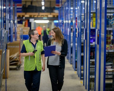 a man and a woman in a warehouse