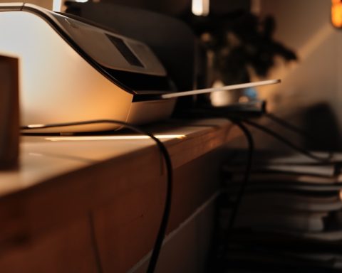 black and gray printer on white table