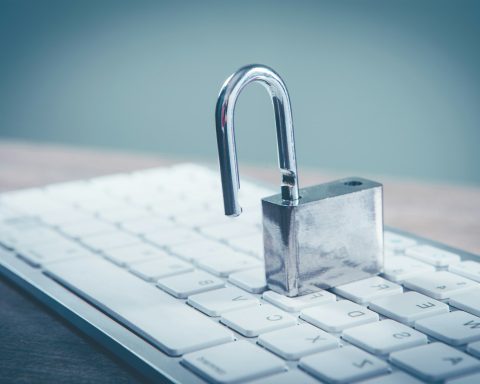 a padlock sitting on top of a computer keyboard