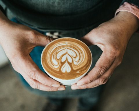 focus photography of coffee artwork