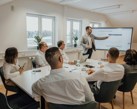 a man giving a presentation to a group of people