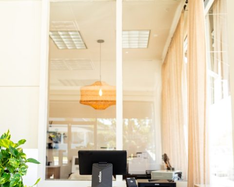 Reception desk with computer and printer.