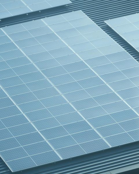 Detailed view of solar panels installed on a rooftop, showcasing green energy.