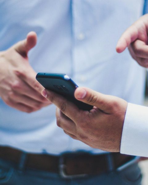 person holding black smartphone
