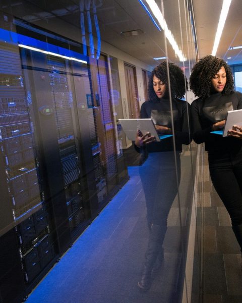 woman in black top using Surface laptop