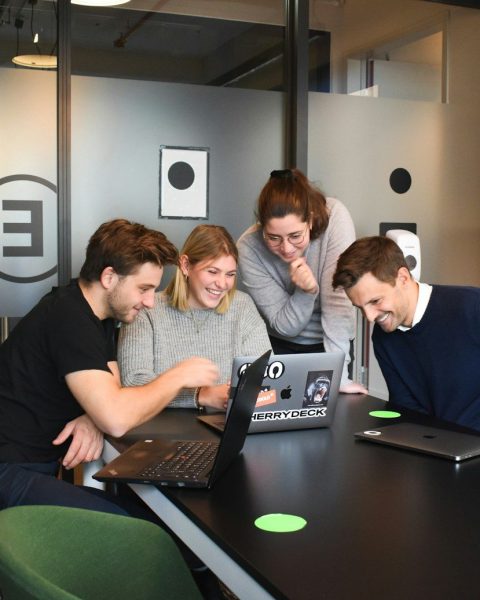 people sitting on chair in front of laptop computers